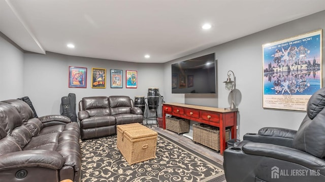 living room with wood finished floors and recessed lighting