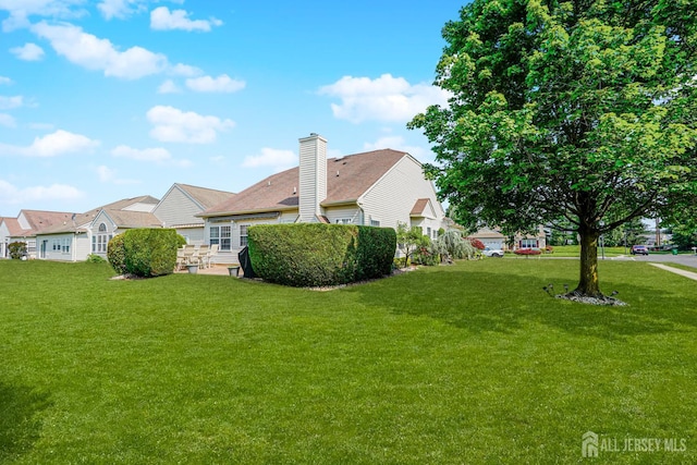 137 Murano Ave, Monroe, NJ 08831 - view of side of home featuring a lawn and a chimney