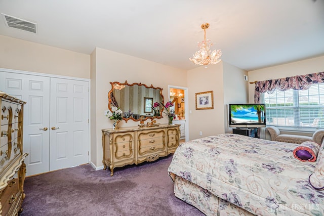 137 Murano Ave, Monroe, NJ 08831 - bedroom with a chandelier, dark carpet, and a closet