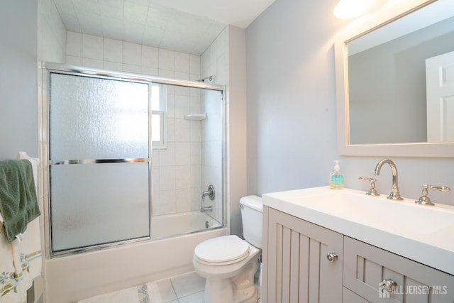 full bath featuring enclosed tub / shower combo, tile patterned floors, toilet, and vanity