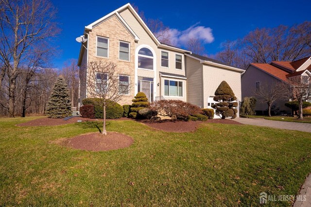 view of property featuring a front yard