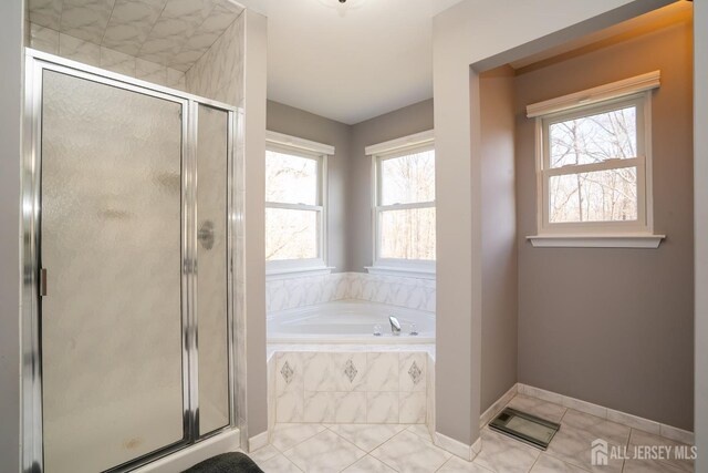 bathroom featuring separate shower and tub and tile patterned floors