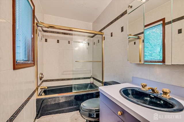 16 Benedek Rd, Princeton, NJ 08540 - full bathroom featuring tile walls, tiled shower / bath, vanity, toilet, and plenty of natural light