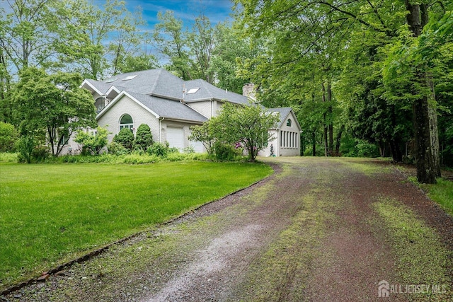16 Benedek Rd, Princeton, NJ 08540 - view of front facade featuring driveway, an attached garage, a front lawn, and a chimney