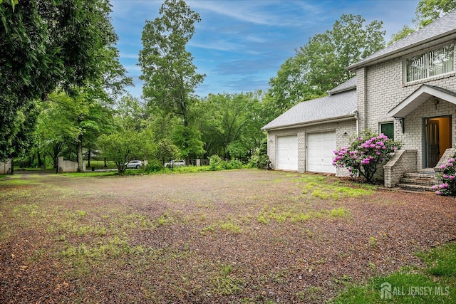 16 Benedek Rd, Princeton, NJ 08540 - view of yard with an attached garage