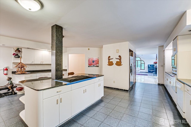 16 Benedek Rd, Princeton, NJ 08540 - kitchen with cooktop, stainless steel fridge, open shelves, a center island, and white cabinetry