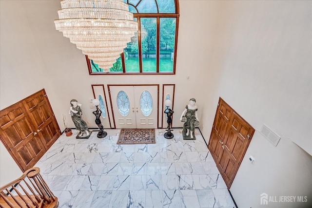 16 Benedek Rd, Princeton, NJ 08540 - foyer entrance with a chandelier, a towering ceiling, and marble look tile flooring