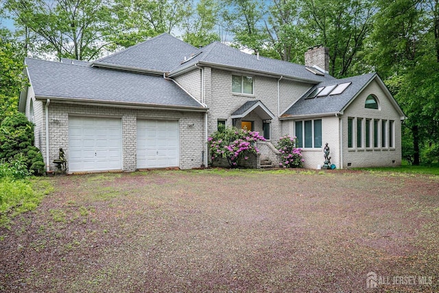 16 Benedek Rd, Princeton, NJ 08540 - view of front of property featuring brick siding, an attached garage, a chimney, and a shingled roof