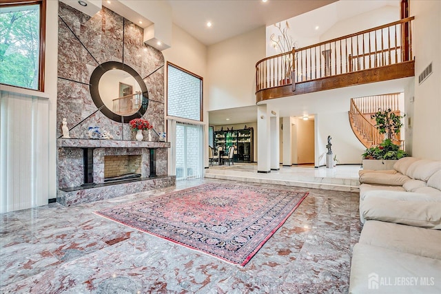 16 Benedek Rd, Princeton, NJ 08540 - living area featuring a towering ceiling, marble tiled flooring, recessed lighting, stairs, and a large fireplace