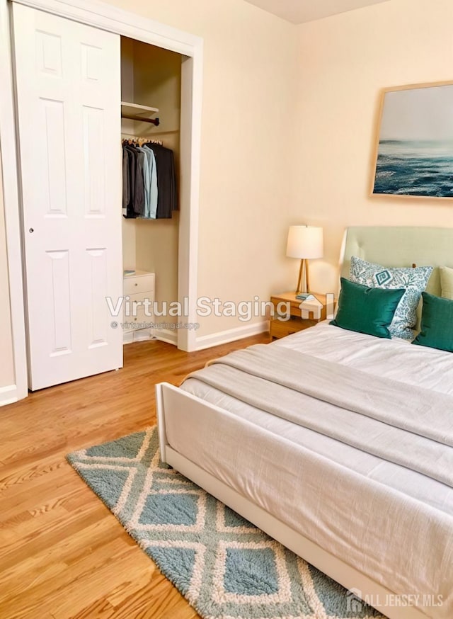 bedroom featuring a closet and hardwood / wood-style floors