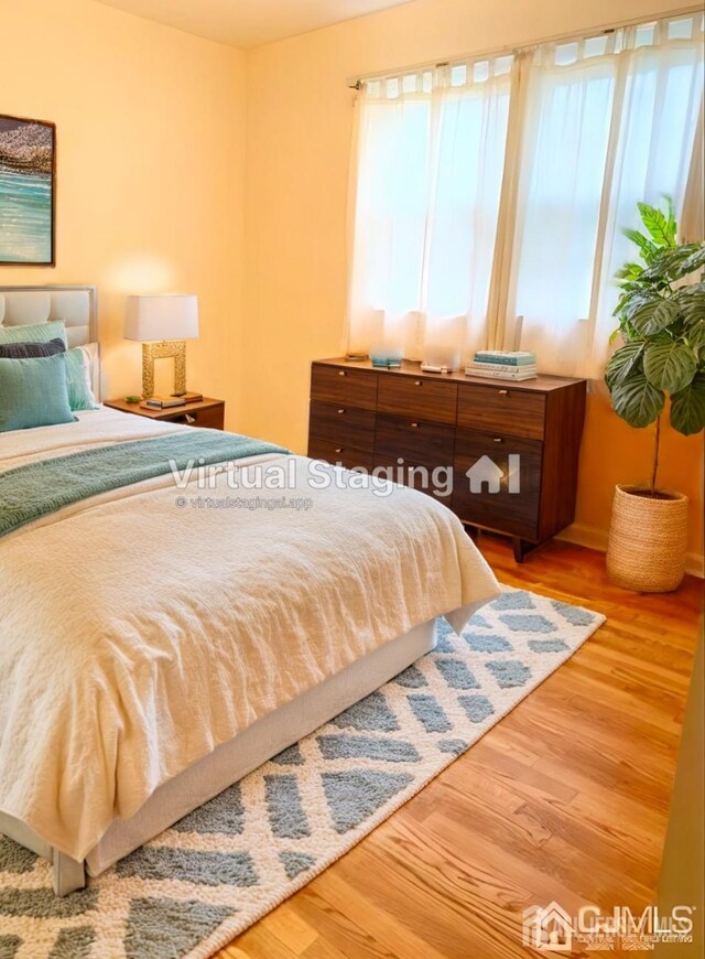 bedroom featuring wood-type flooring