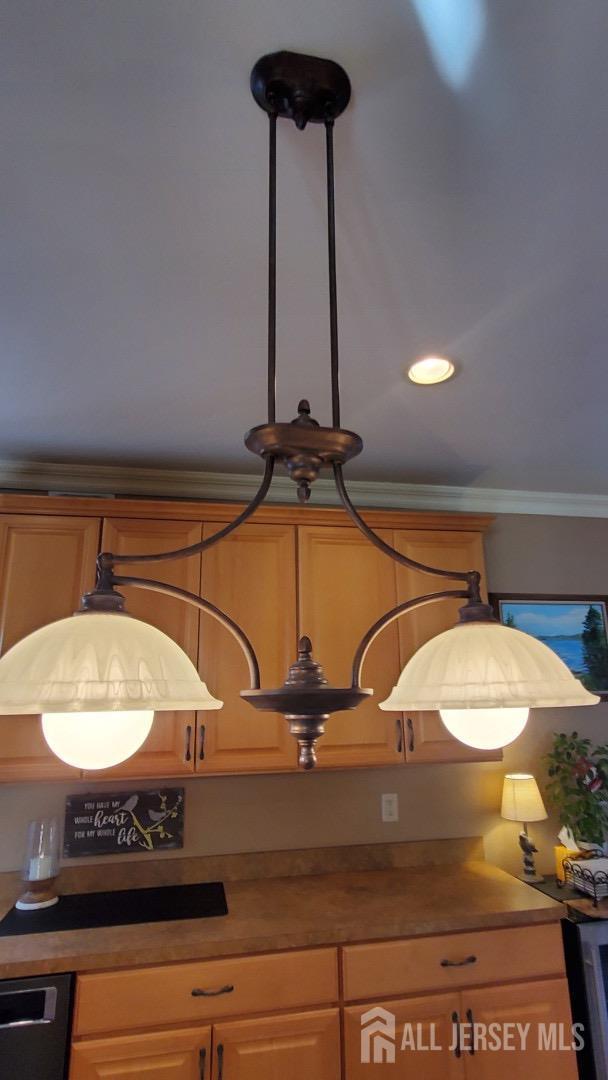 interior details with dishwasher and ornamental molding