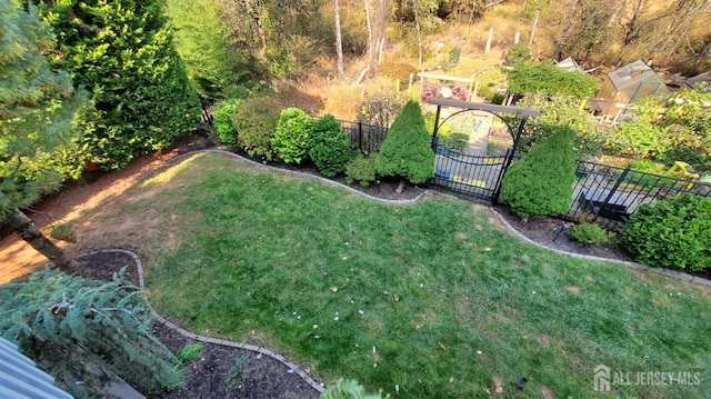 view of yard featuring a gate and fence