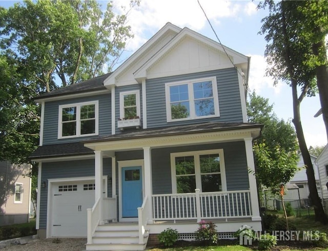 42 Lincoln Ave, Metuchen, NJ 08840 - view of front facade featuring covered porch, an attached garage, a shingled roof, and board and batten siding