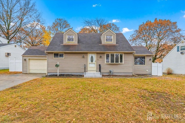 cape cod-style house with a garage, a front yard, fence, and driveway