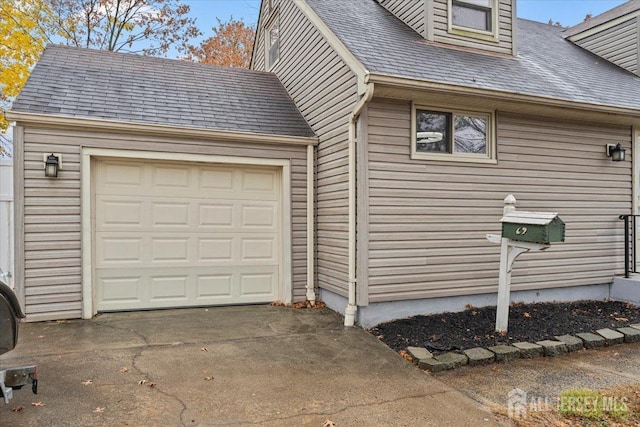 view of side of home with a garage