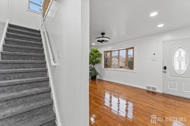 entryway with wood-type flooring