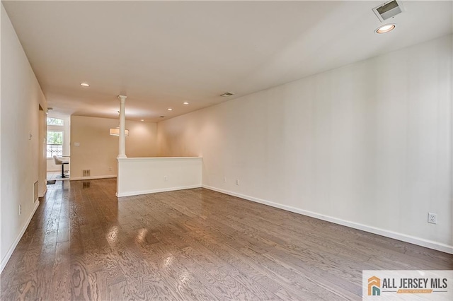 303 Harvest Ln, South Brunswick, NJ 08852 - spare room featuring wood finished floors, decorative columns, and recessed lighting
