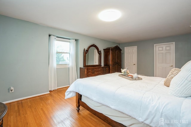8 Appletree Ln, East Brunswick, NJ 08816 - bedroom with baseboards and light wood-style floors