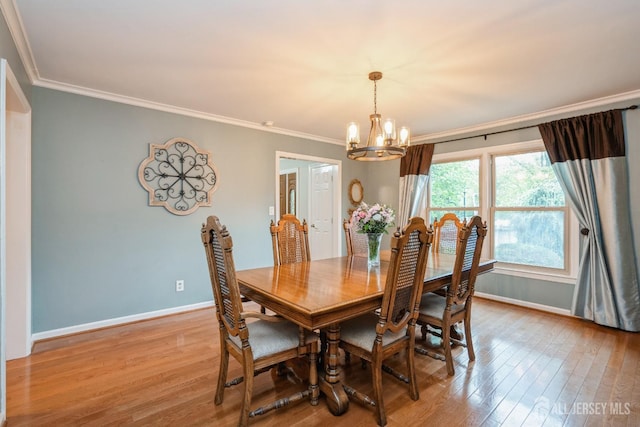 8 Appletree Ln, East Brunswick, NJ 08816 - dining space with a chandelier, light wood-style floors, ornamental molding, and baseboards