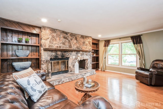 8 Appletree Ln, East Brunswick, NJ 08816 - living room with a fireplace, wood finished floors, baseboards, ornamental molding, and built in shelves