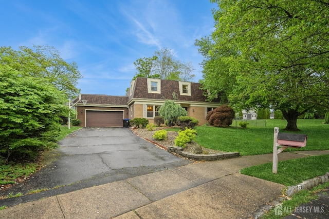 8 Appletree Ln, East Brunswick, NJ 08816 - view of front of home with mansard roof, a shingled roof, a front yard, an attached garage, and driveway