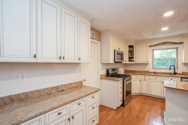 8 Appletree Ln, East Brunswick, NJ 08816 - kitchen featuring appliances with stainless steel finishes, a sink, backsplash, light stone counters, and recessed lighting