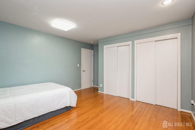 8 Appletree Ln, East Brunswick, NJ 08816 - bedroom featuring multiple closets, wood finished floors, recessed lighting, and baseboards