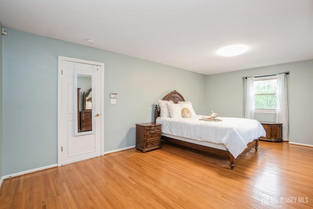 8 Appletree Ln, East Brunswick, NJ 08816 - bedroom with light wood finished floors and baseboards
