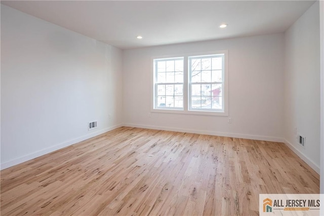 empty room with light wood-type flooring