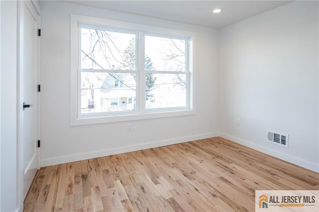 unfurnished room featuring light wood-type flooring