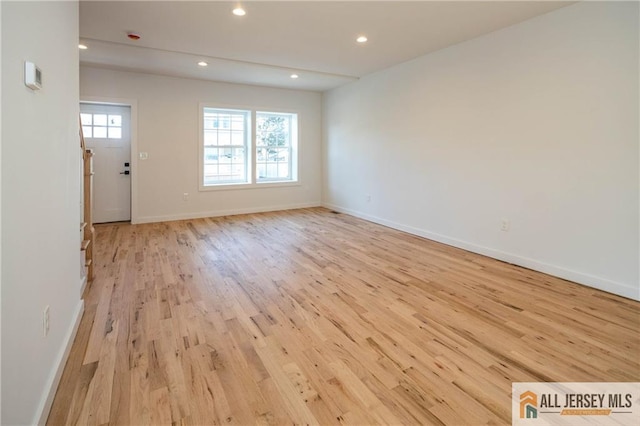 unfurnished living room featuring light wood-type flooring