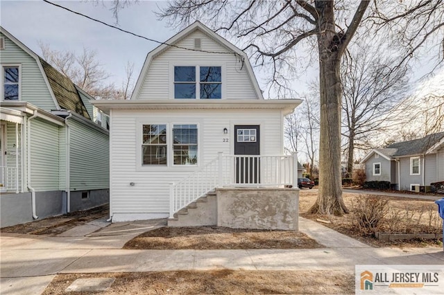 colonial inspired home with a gambrel roof