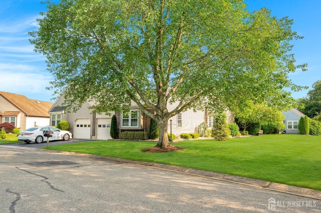 3 William Harrison Dr Unit A, Monroe, NJ 08831 - view of property hidden behind natural elements with driveway, an attached garage, and a front lawn