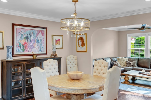 3 William Harrison Dr Unit A, Monroe, NJ 08831 - dining area featuring wood finished floors, ornamental molding, a chandelier, and arched walkways