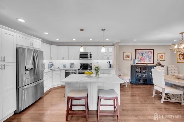 3 William Harrison Dr Unit A, Monroe, NJ 08831 - kitchen with stainless steel appliances, a sink, white cabinetry, tasteful backsplash, and a center island