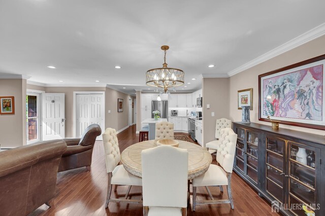 3 William Harrison Dr Unit A, Monroe, NJ 08831 - dining room with dark wood-style flooring, a chandelier, recessed lighting, and crown molding