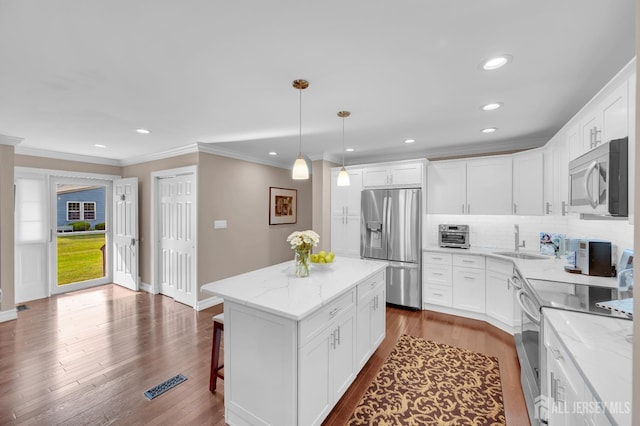 3 William Harrison Dr Unit A, Monroe, NJ 08831 - kitchen with appliances with stainless steel finishes, light stone counters, backsplash, a sink, and dark wood finished floors