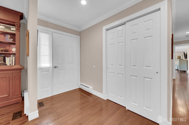 3 William Harrison Dr Unit A, Monroe, NJ 08831 - entrance foyer with ornamental molding, wood finished floors, a baseboard heating unit, baseboards, and recessed lighting