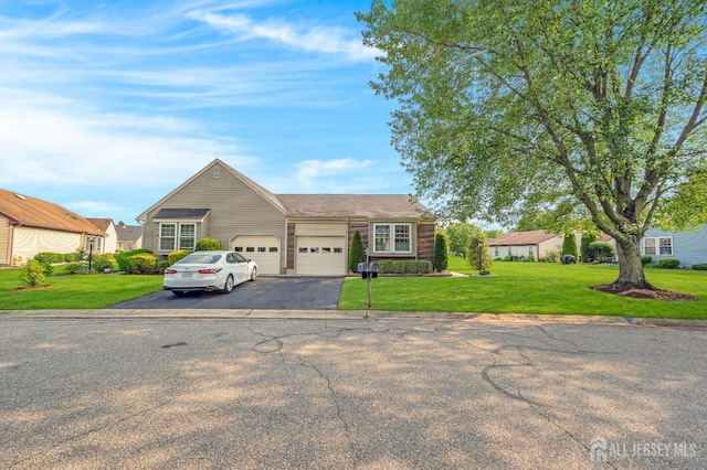 3 William Harrison Dr Unit A, Monroe, NJ 08831 - view of front of house with asphalt driveway, a garage, and a front lawn