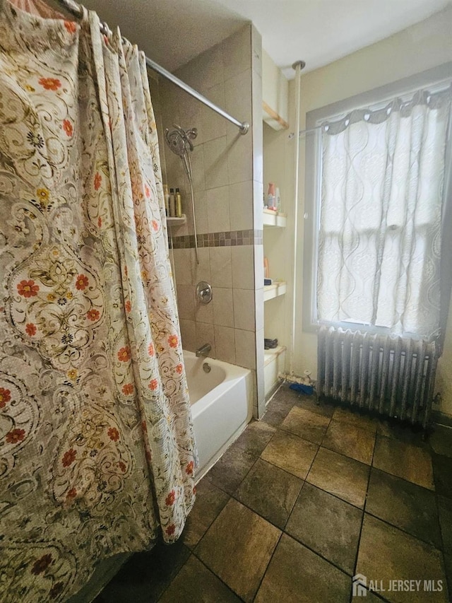 bathroom with radiator heating unit and shower / bath combo with shower curtain