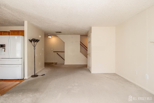 313 Prestwick Way, Edison, NJ 08820 - unfurnished living room featuring light carpet and a textured ceiling