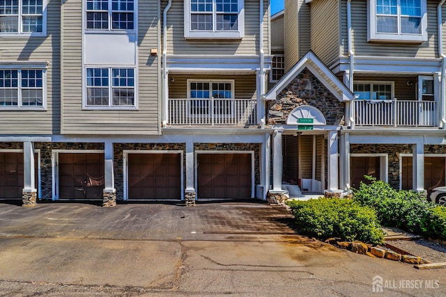 313 Prestwick Way, Edison, NJ 08820 - view of front of property featuring stone siding, driveway, and an attached garage