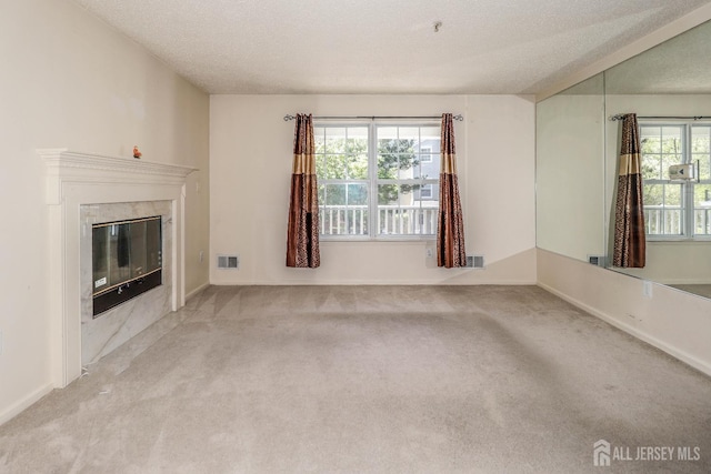 313 Prestwick Way, Edison, NJ 08820 - unfurnished living room with carpet floors, a textured ceiling, a high end fireplace, and baseboards