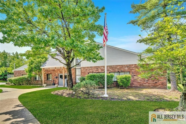 127 Pennsylvania Way N, Brunswick, NJ 08902 - view of front of house with a front lawn and brick siding