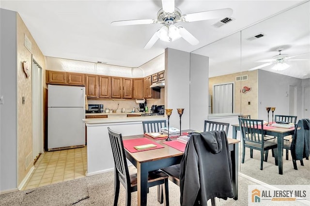 127 Pennsylvania Way N, Brunswick, NJ 08902 - dining space with ceiling fan, baseboards, and light colored carpet