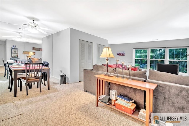 127 Pennsylvania Way N, Brunswick, NJ 08902 - carpeted living area with a ceiling fan and baseboards