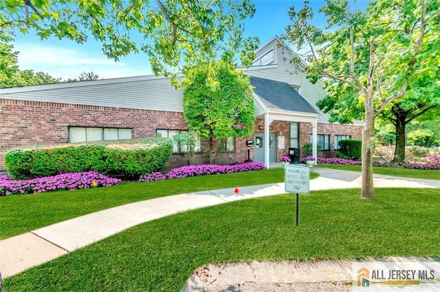 127 Pennsylvania Way N, Brunswick, NJ 08902 - view of front of house with brick siding and a front yard