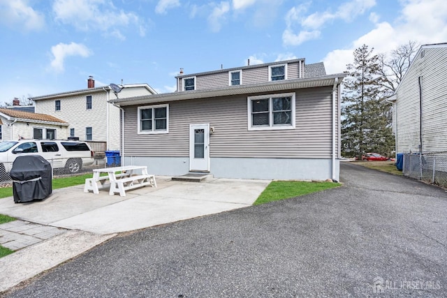 exterior space with entry steps and a patio area