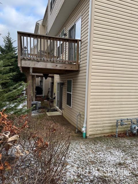 view of property exterior featuring a deck